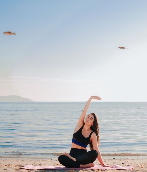 Person sitting in a calm meditative pose after a workout.